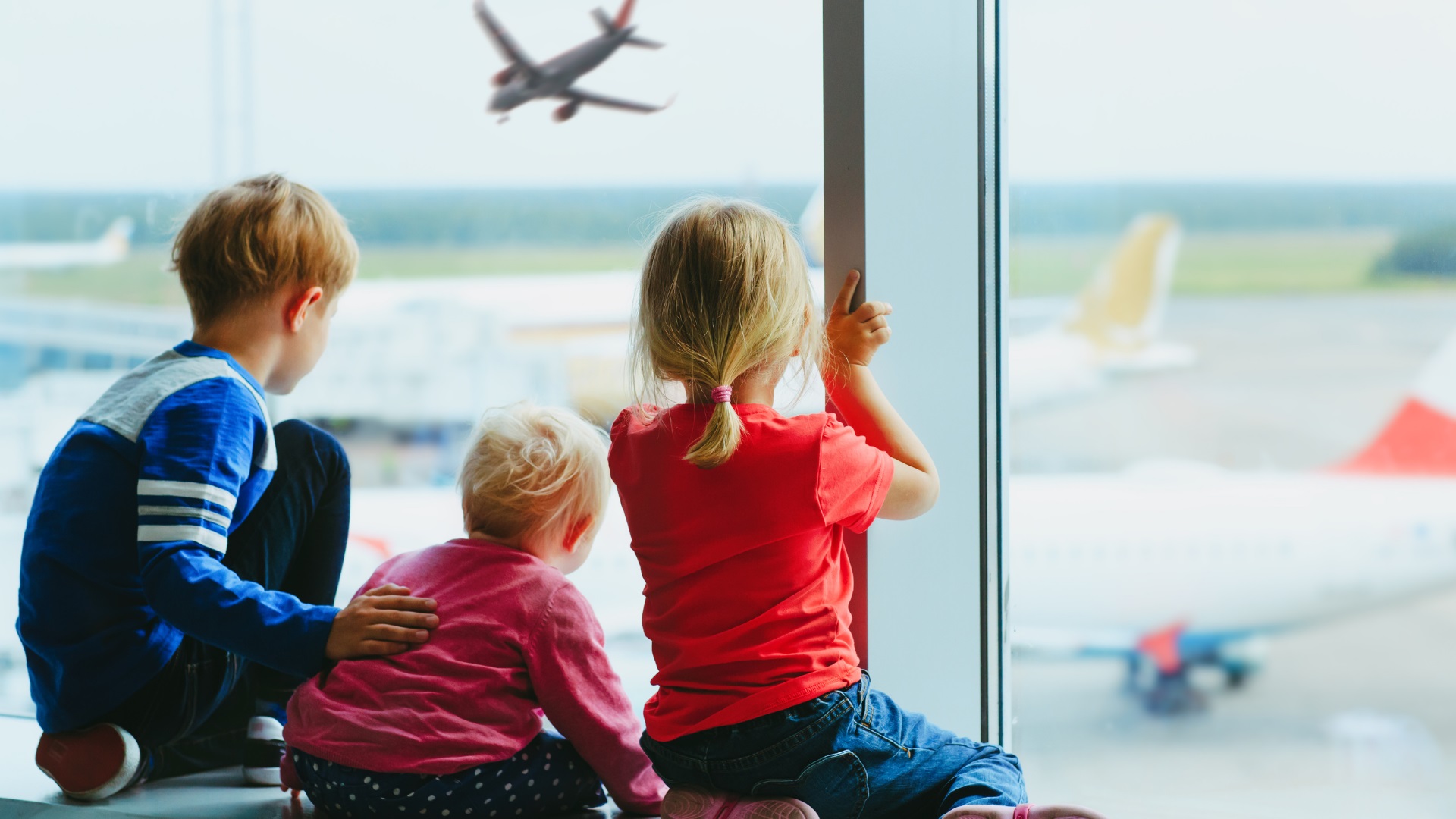 Children at an airport after a consent letter for children travelling abroad was given