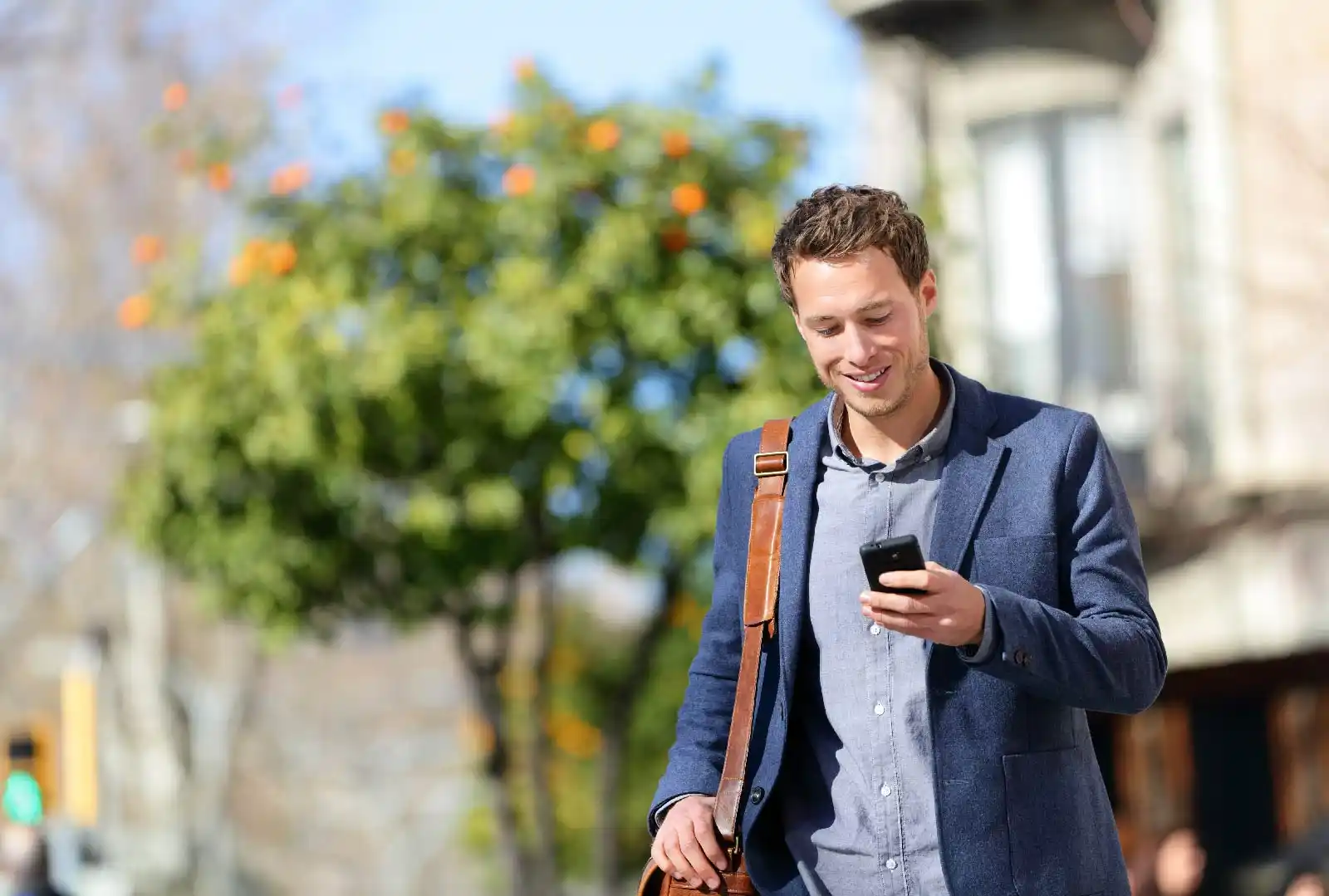 Man applying for a Spanish medical certificate on his phone