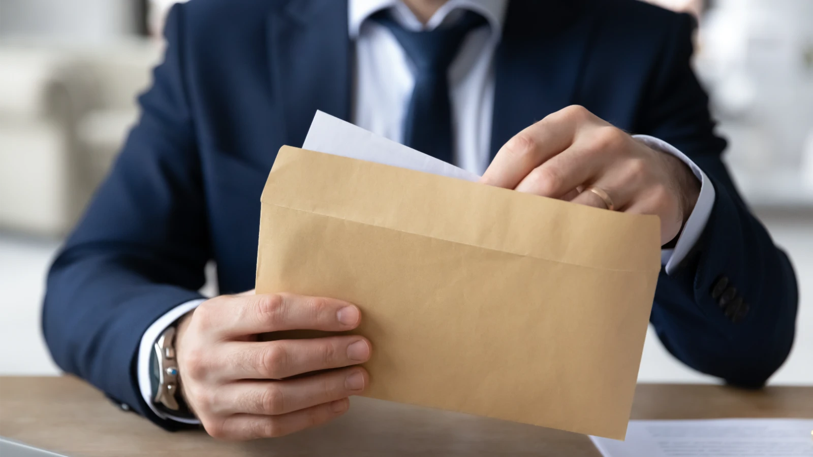 Businessman opening a Letter of Undertaking.