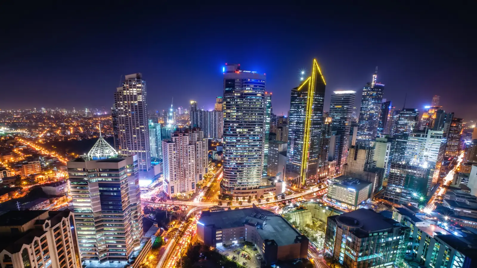 A night time cityscape of Manila to represent going to the Philippines on a Philippines Visa from the UK.